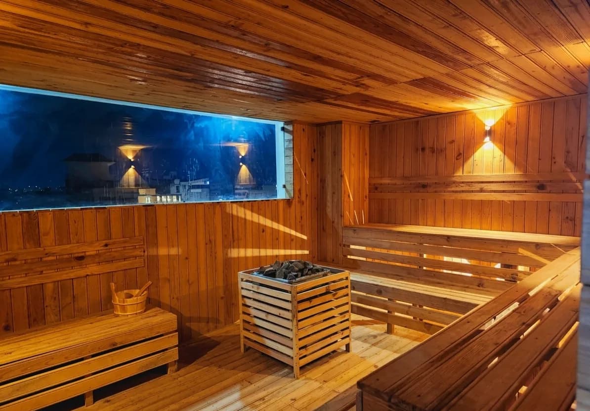 Sauna at night, city lights through the window